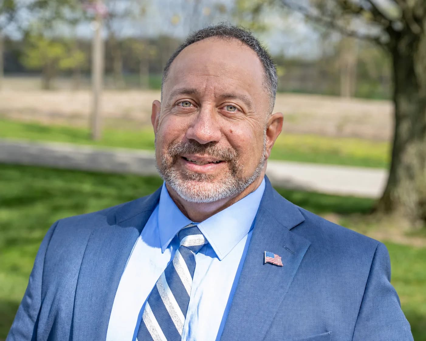 Stephen Levorchick outdoors in a blue suit
